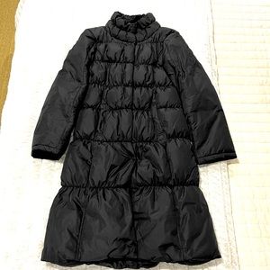 Halogen high neck, mid length black down coat.